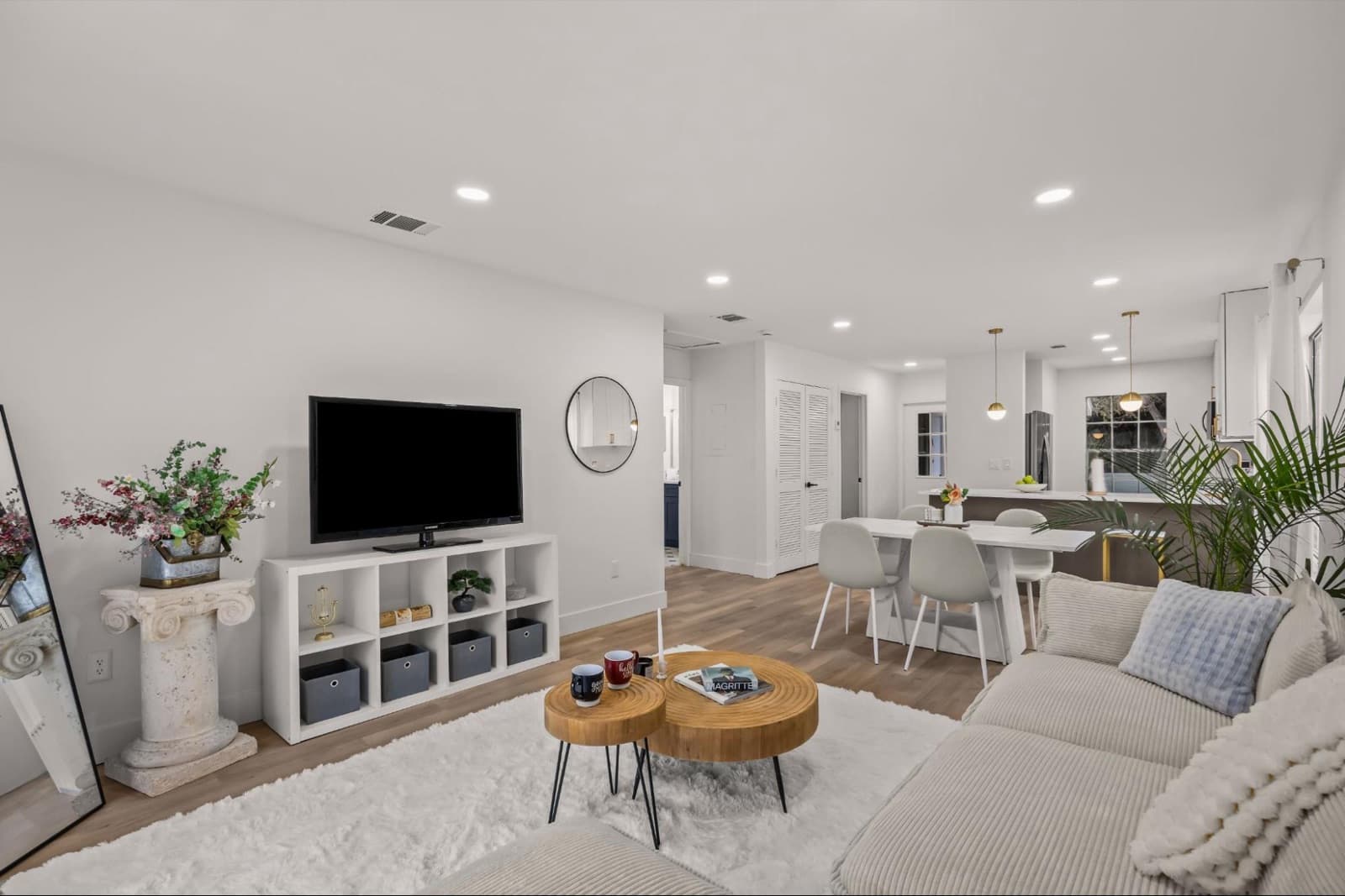 After our full renovation: a bright, open, staged living and dining area